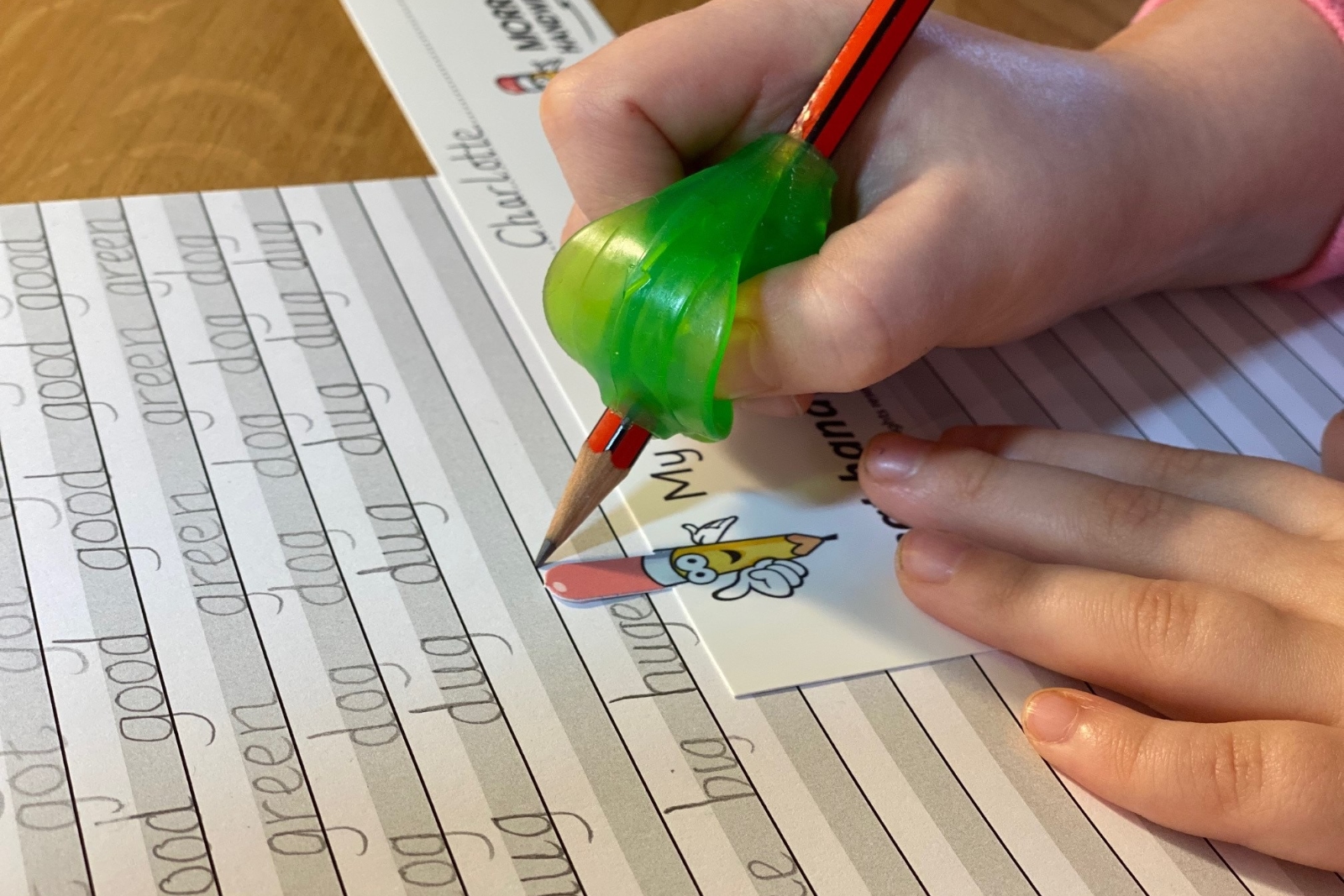 Grotto Grip used with a pencil and hand writing book
